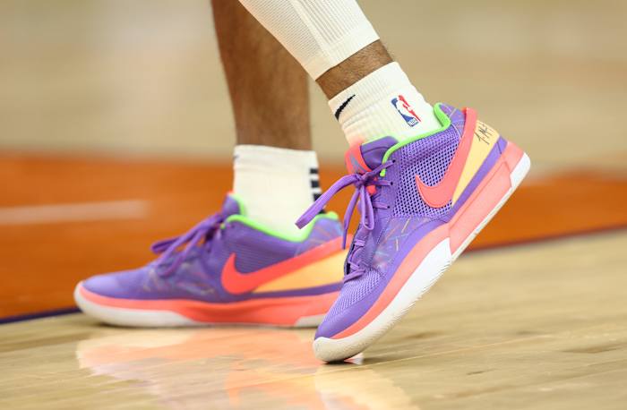 View of Ja Morant's purple and orange shoes.